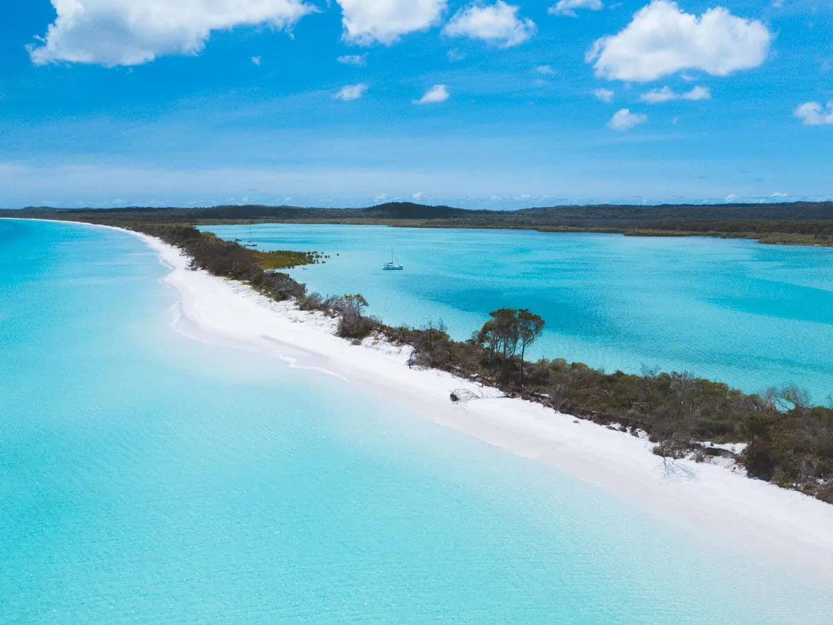 Crystal-clear waters of Lake McKenzie, surrounded by white sandy beaches.